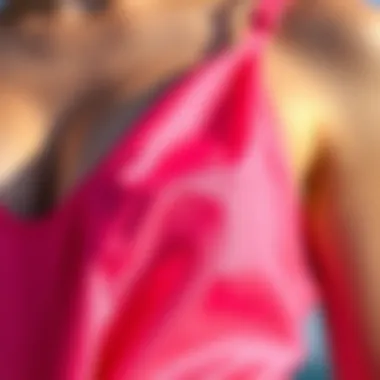 Fabric Detail of Bright Pink Tankini Close-up of the intricate fabric design of a bright pink tankini showcasing texture and style.