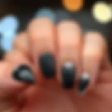 Elegant black heart nail stickers displayed on a stylish manicure