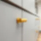 Elegant gold kitchen cabinet handle on a sleek modern cabinetry