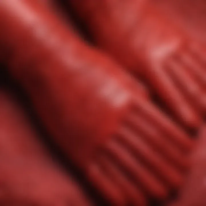 Close-up of intricate stitching on luxurious red gloves