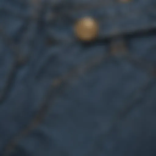 A close-up of the fabric texture of a high waisted blue jean skirt, highlighting its durability and style.