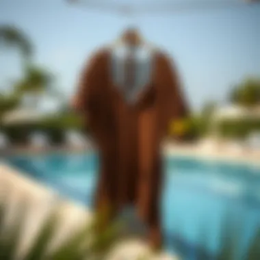 Chic Poolside Elegance Elegant brown bathing suit cover up hanging by the poolside